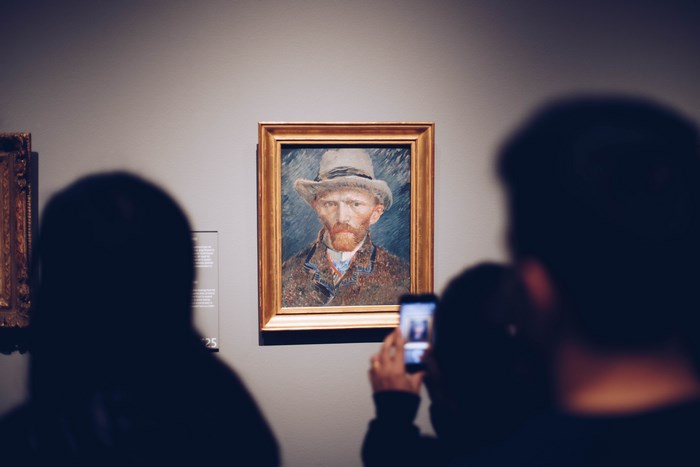 Van Gogh self-portrait in a museum gallery