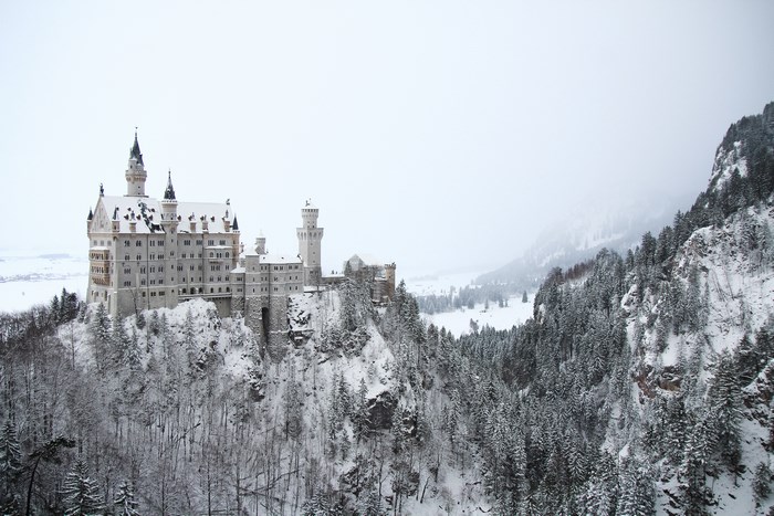 Snow-Covered Neuschwanstein Castle in Winter Forest