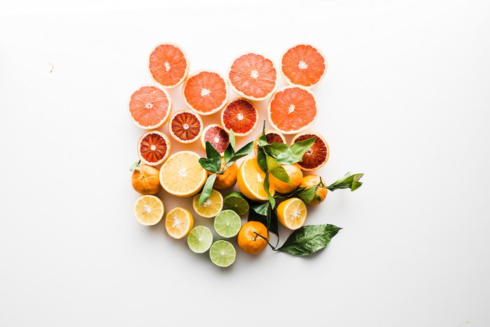 Assortment of Citrus Fruits and Leaves