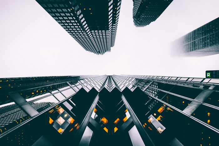 Looking up at skyscrapers in Toronto on a foggy day