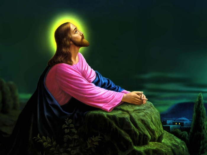 Jesus Praying at Night with Glowing Halo