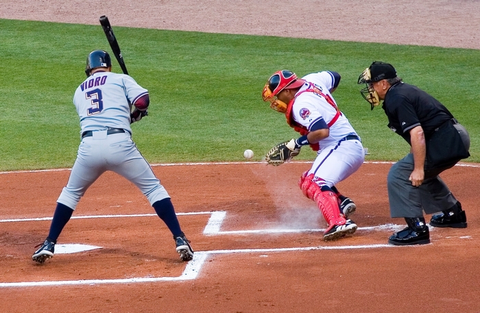 Baseball game with batter, catcher, and umpire