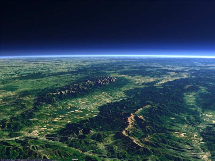 Earth from space over mountains and plains