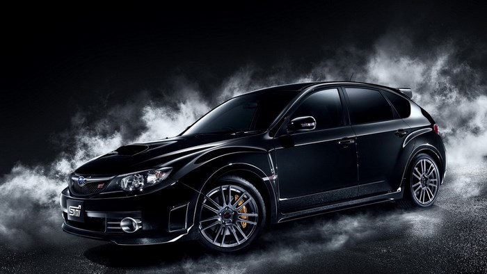 Black Subaru Impreza WRX STI hatchback in smoke