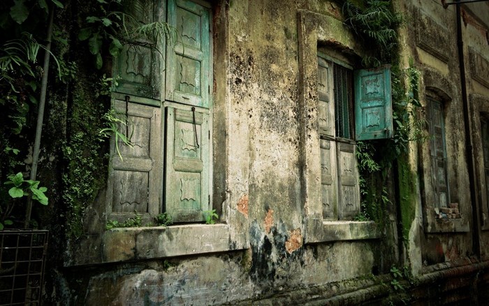 Mystical Old House with Weathered Green Shutters