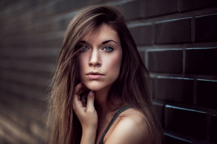 Woman with long brown hair and blue eyes