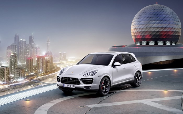 White Porsche Cayenne Turbo S in futuristic city