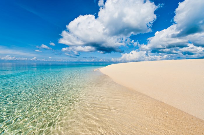 Pretty beach with clear turquoise water and white sand