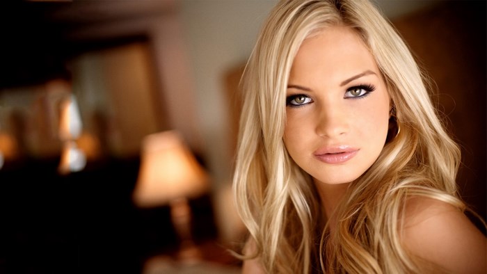 Blonde Woman with Soft Lighting and Warm Background