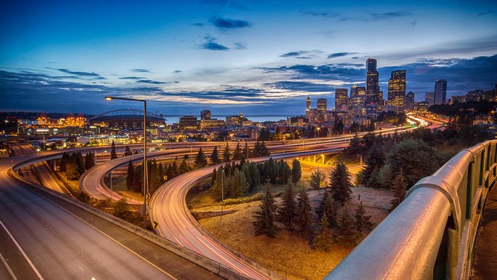 Seattle cityscape with highway at dusk
