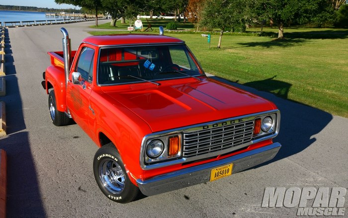 Red Dodge pickup truck with stacks