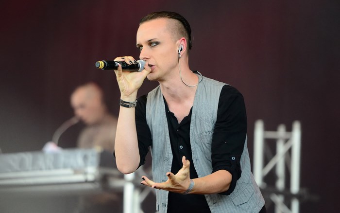 Solar Fake singer performing on stage