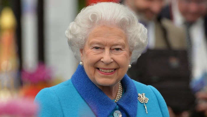 Smiling Queen Elizabeth II in Blue Coat
