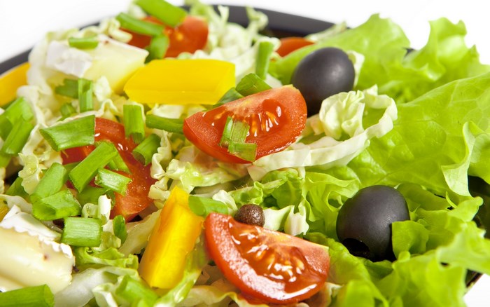 Fresh salad with tomatoes, olives, and cheese