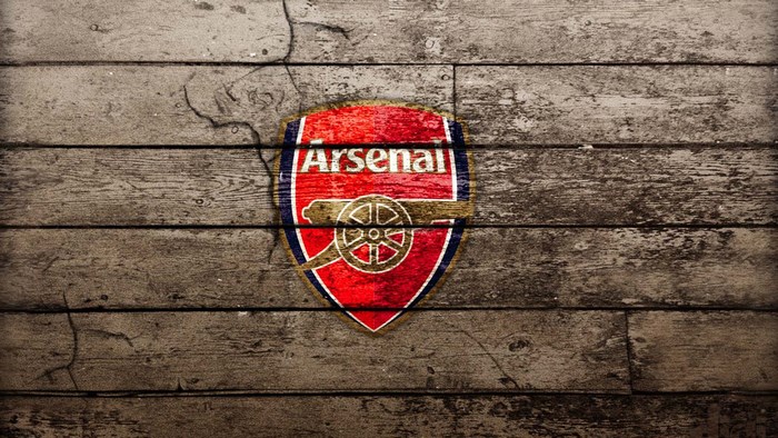 Arsenal FC logo on wooden planks