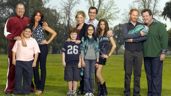 Modern Family cast posing in a park