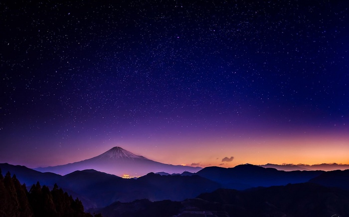 Mount Fuji under a starry night sky