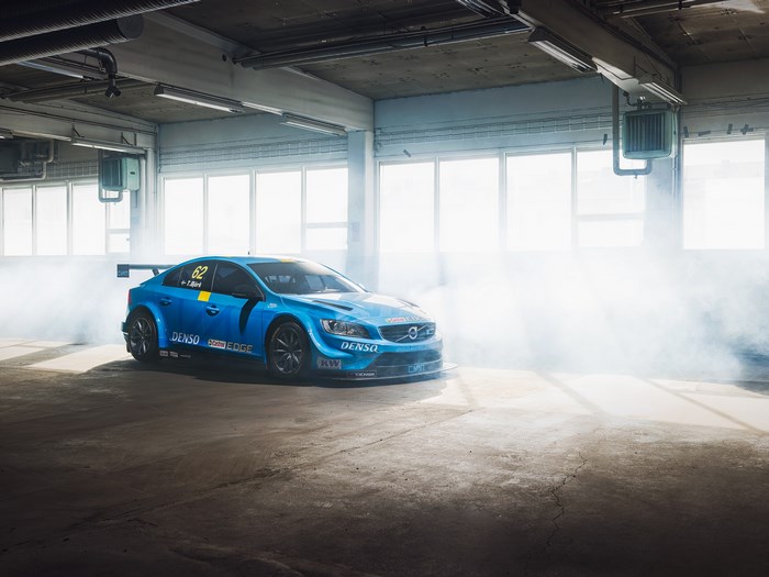 Blue Volvo S60 Polestar race car in garage