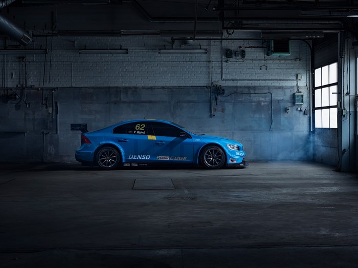 Blue Volvo S60 Polestar race car in garage
