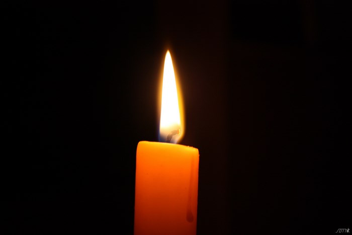Close-up of a lit orange candle