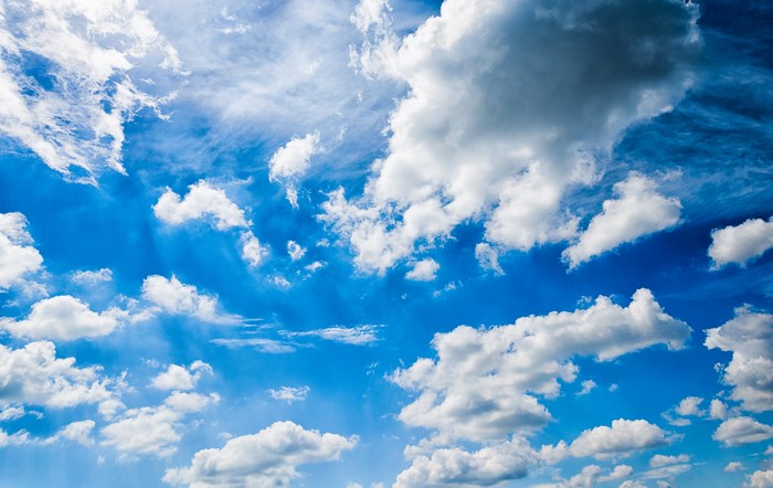Bright Blue Sky with Scattered White Clouds