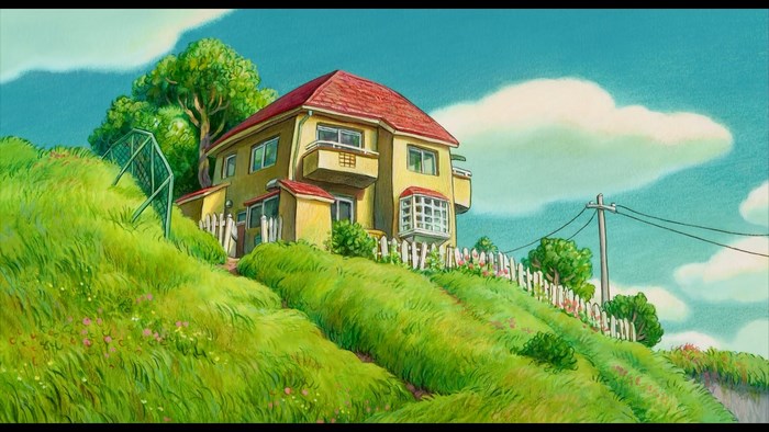 Sunny Hill with Yellow House and Blue Sky