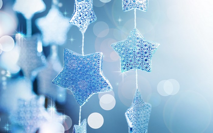 Blue star ornaments with bokeh lights