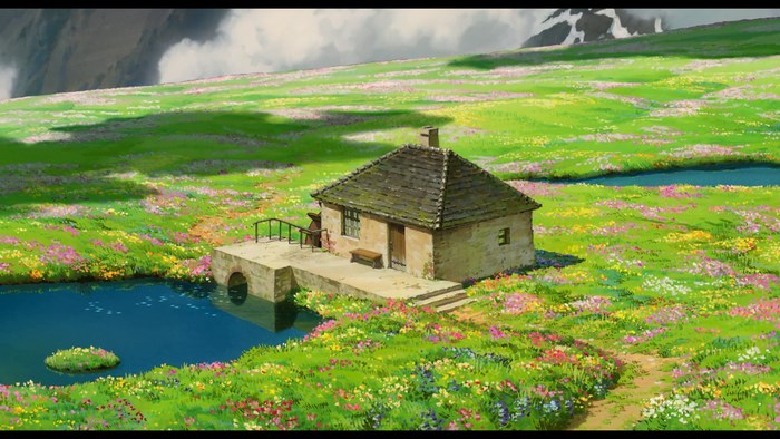 Howl's Moving Castle cottage in a flower field