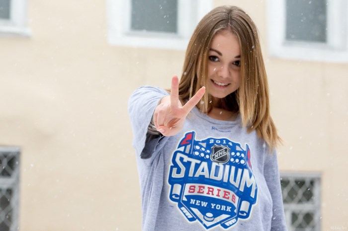 Girl with peace sign in snow