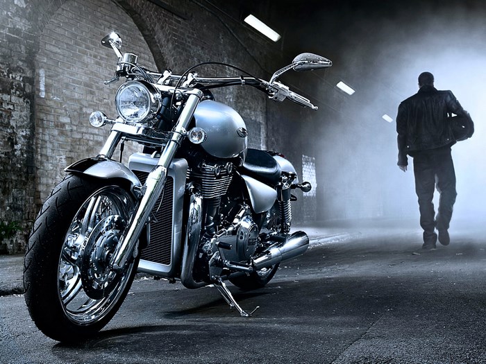 Harley Davidson motorcycle with a man walking away