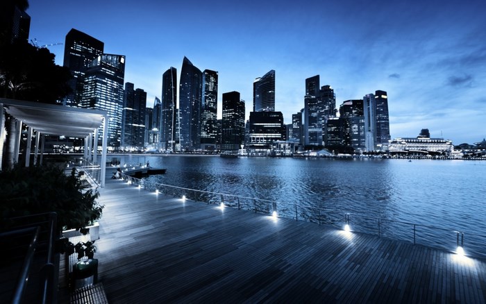 Singapore skyline at dusk over the water