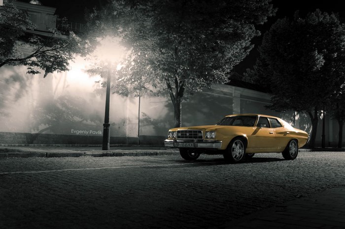 Yellow Ford Gran Torino parked at night
