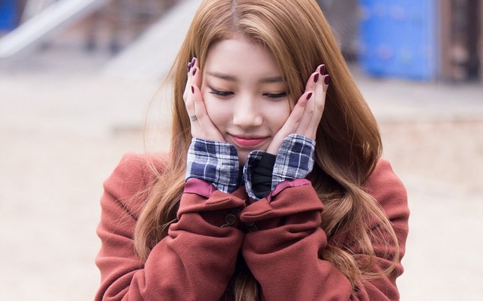 Bae Suzy with hands on cheeks