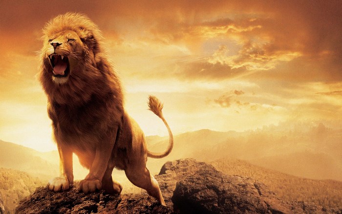 Aslan from The Chronicles of Narnia roaring on a rock