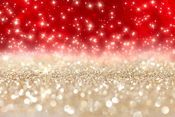 Sparkling stars on a red and gold glitter background