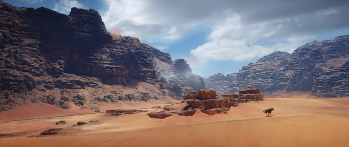 Man on horseback in desert canyon