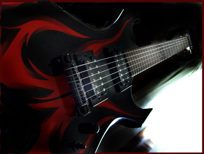 Electric guitar with red flame design