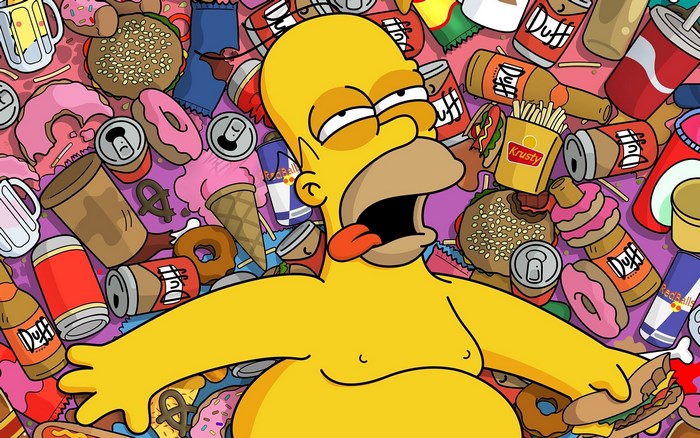 Homer Simpson surrounded by junk food and drinks