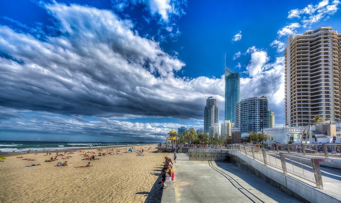 Gold Coast beach with high-rise buildings and cloudy sky
