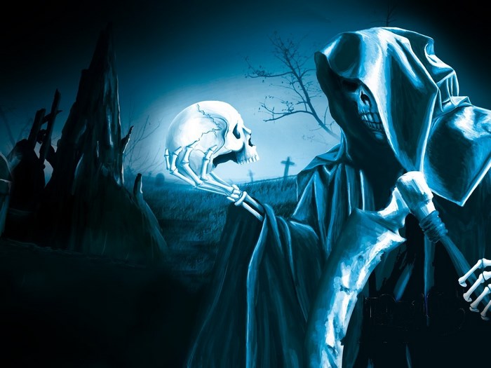 Grim Reaper holding a skull in a graveyard