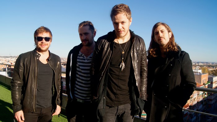 Imagine Dragons band members on a rooftop