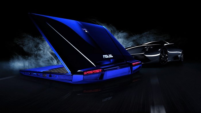 Blue Asus laptop and black sports car
