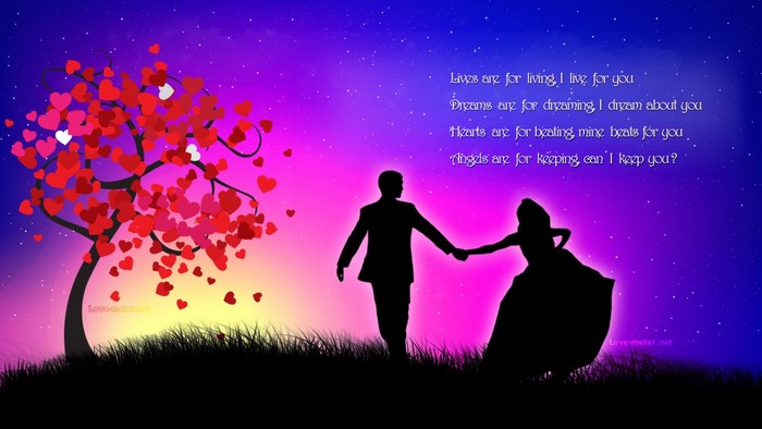 Couple holding hands under a heart tree at sunset