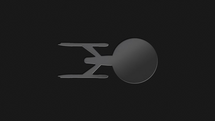 Star Trek Enterprise silhouette on dark background