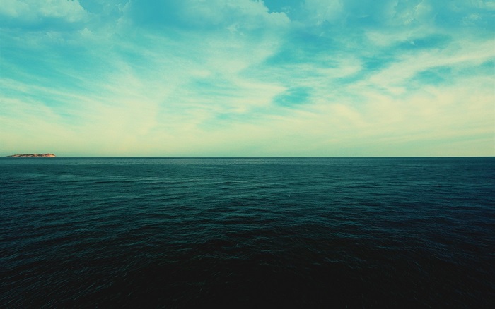 Ocean and Sky with Distant Island