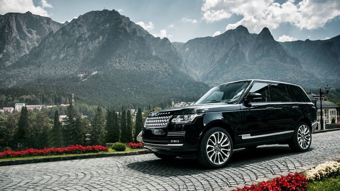 Black Range Rover in front of mountains