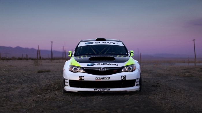 Subaru rally car in desert landscape