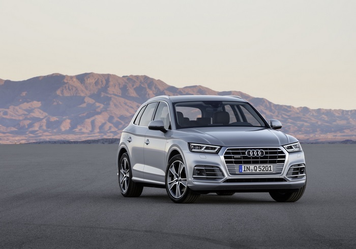 Silver Audi Q5 SUV in desert landscape