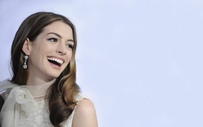 Anne Hathaway laughing