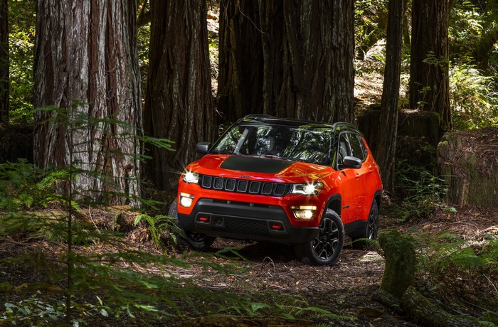 Orange Jeep Compass Trailhawk in Forest